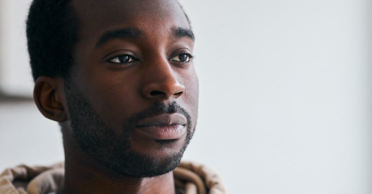 Man staring at a wall trying to overcome the stigma of having a DUI in Tennessee.